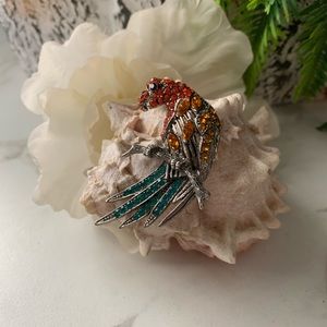 Rhinestones Parrot on a branch brooch.